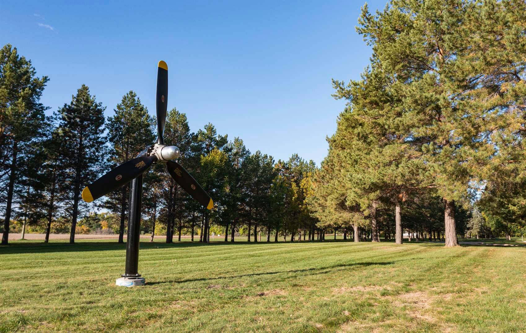 A propeller on green space within the grounds of the North Dakota Veterans Home.